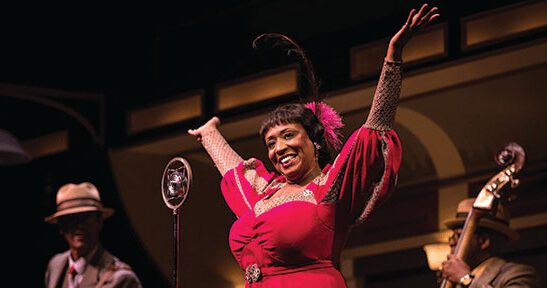 woman onstage in celebration