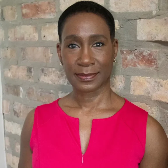 A woman in a pink shirt.