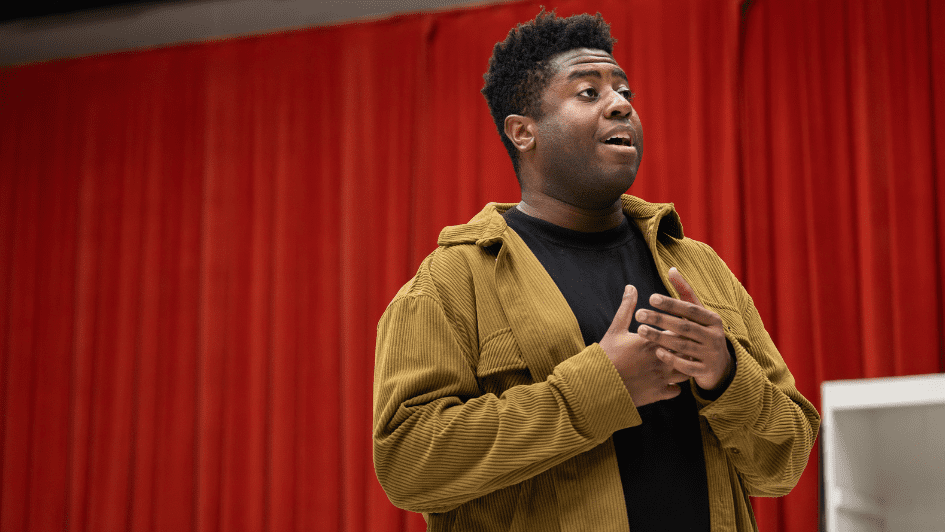 Juicy wears a black top and khaki jacket.