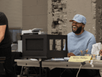 Tyrone Phillips wears a light blue Chicago bulls cap and wears a matching sweatshirt.