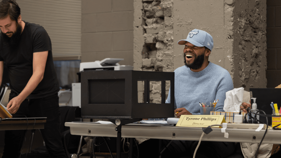 Tyrone Phillips wears a light blue Chicago bulls cap and wears a matching sweatshirt.