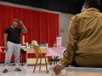 Ronald L. Conner looking at Trumane Alston.