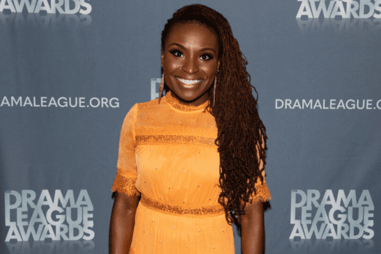 Brittney Mack wears a yellow dress.