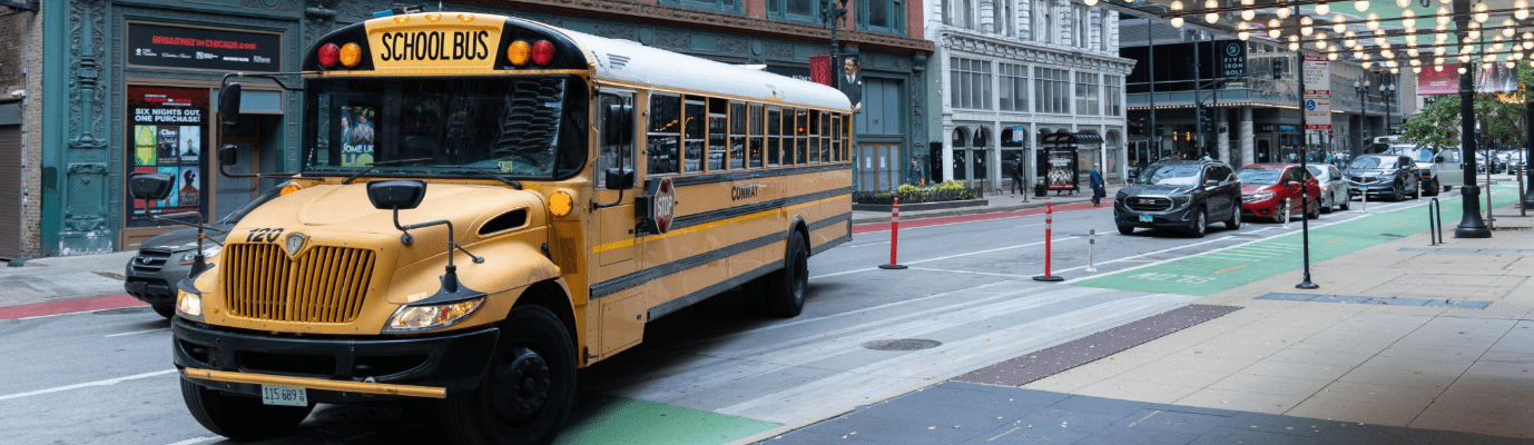 School bus parked in front of Goodman Theatre.