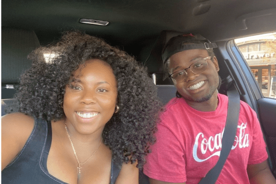Victoria and Ivan smiling in a car.