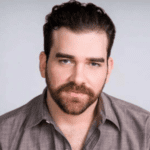 Headshot of Adam Benjamin.