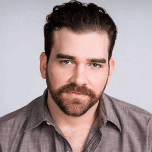 Headshot of Adam Benjamin.