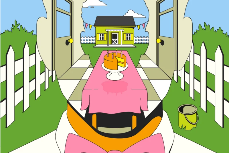 A table with a pink cloth and a cake sits in a garden between open doors, leading to a yellow house with bunting, white fences, and a paint can on the grass.