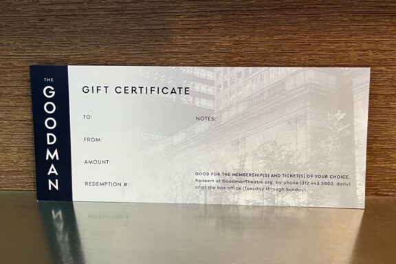 A Goodman Theatre gift certificate showing spaces for recipient, sender, amount, notes, and redemption number, with redemption details printed at the bottom.