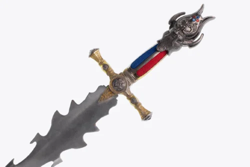 A decorative sword with a wavy blade, ornate metallic guard, and a handle wrapped in red and blue fabric.