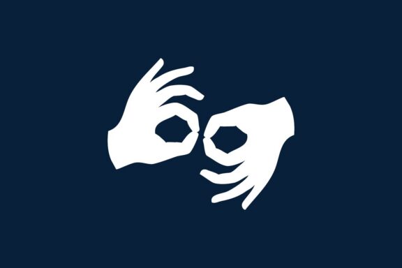 Two white hands on a dark blue background forming the "sign language" symbol, with fingers making circles and other fingers extended.