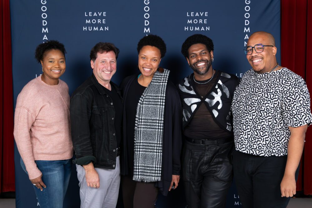 Five people stand side-by-side in front of a blue backdrop with the text “LEAVE MORE HUMAN” repeated vertically.