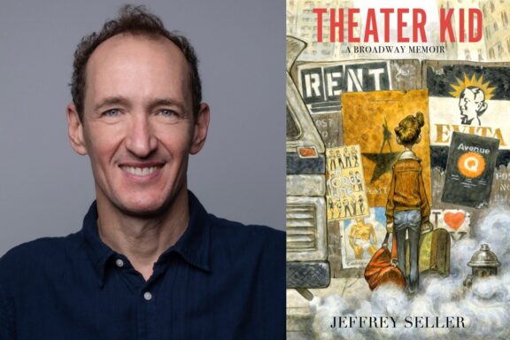 A man smiles at the camera next to the book cover of "Theater Kid: A Broadway Memoir" by Jeffrey Seller, featuring an illustrated person with a suitcase facing Broadway signs.