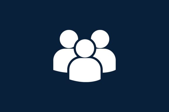 White icon of three generic human figures on a dark blue background, symbolizing a group or team.